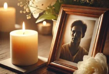 image représentant un mémorial paisible avec une photo encadrée d’un père, une bougie allumée et des fleurs blanches, créant une atmosphère sereine et réfléchie